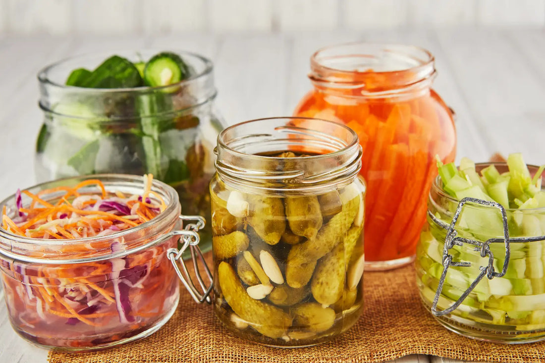 Fermented foods in jars on a wooden table